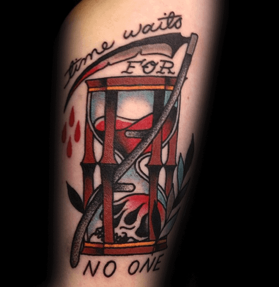 Colorful tattoo of an hourglass with red sand, a scythe, blood drops, leaves, and the phrase Time Waits for No One in bold script.