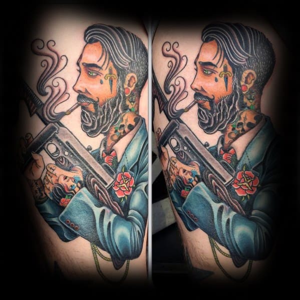 Neo-traditional tattoo of a stylish bearded man in a suit holding a Tommy gun, featuring bold colors, fine details, and smoke effects.