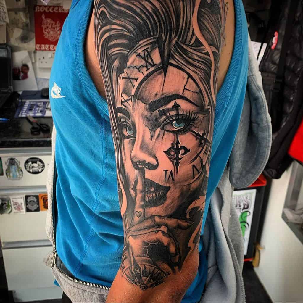 Arm tattoo featuring a woman's face with clock elements