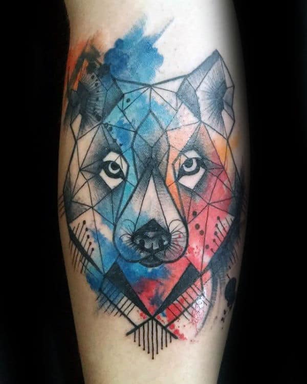 Geometric wolf tattoo accented by vibrant splashes of blue, red, and orange watercolor
