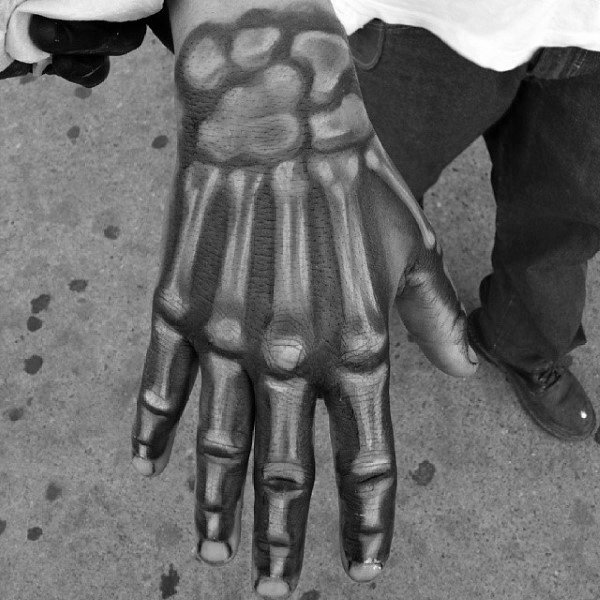 Cool White Ink Over Black Shaded Male Skeleton Hand Tattoos