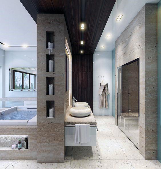 Modern bathroom with large mirror, twin sinks, and glass door shower