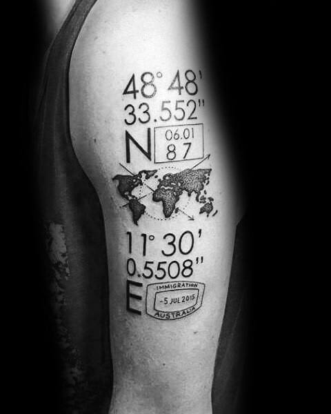 Detailed coordinate tattoo on the upper arm featuring a world map, date box, and an immigration stamp, symbolizing travel and meaningful locations.