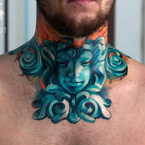 Artistic throat tattoo featuring a serene blue sculpture-like face with intricate swirls, accented by bold orange and copper tones