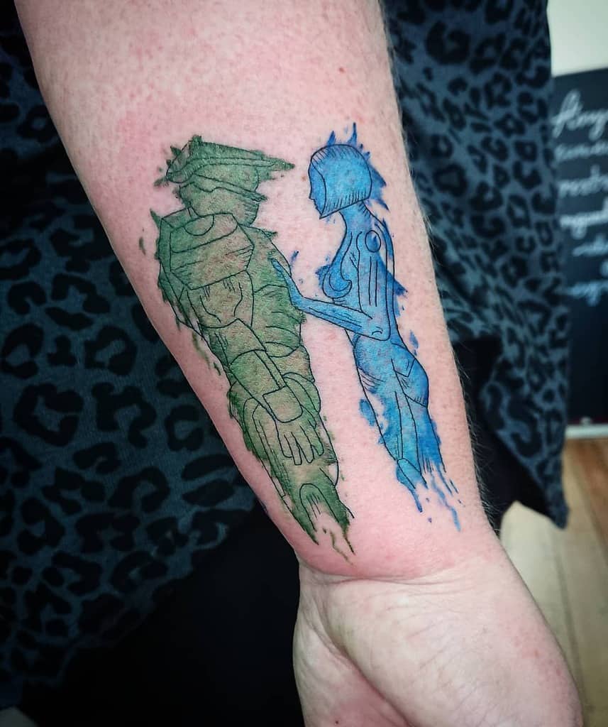 Emotional Halo tattoo of Master Chief and Cortana reaching for each other, depicted in a digital, fading effect, inked on the forearm.