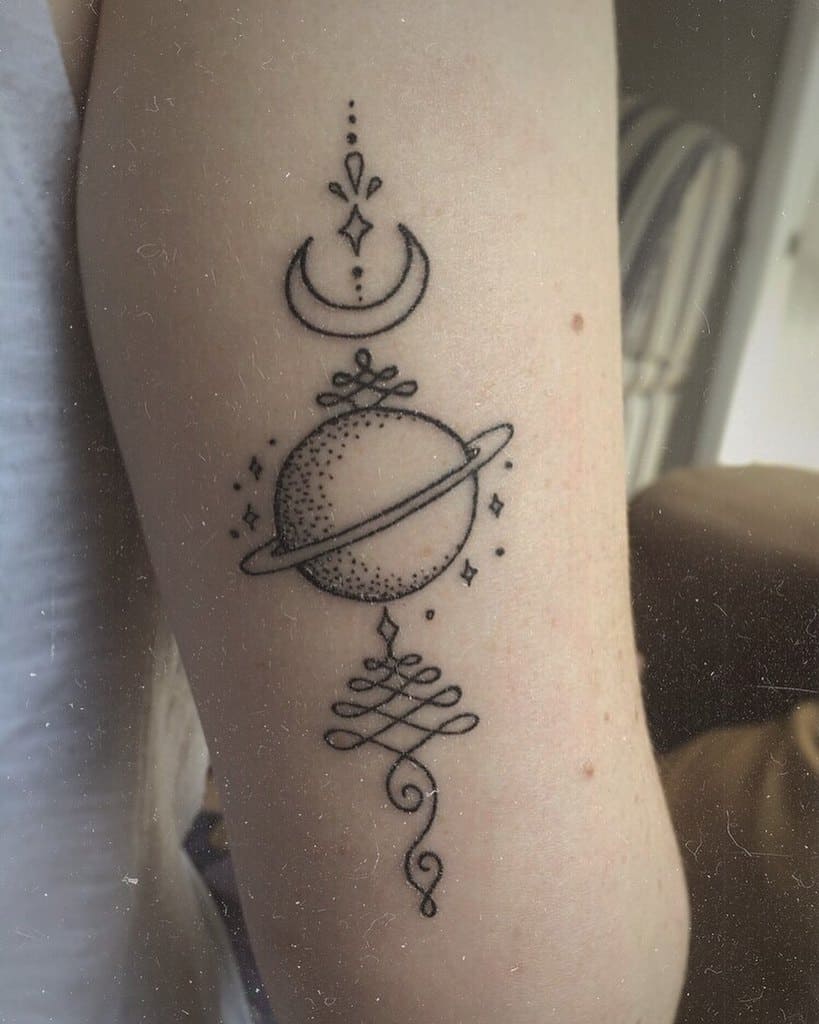 Unalome tattoo with a crescent moon and planet on the arm, symbolizing cosmic energy, spiritual journey, and personal growth.