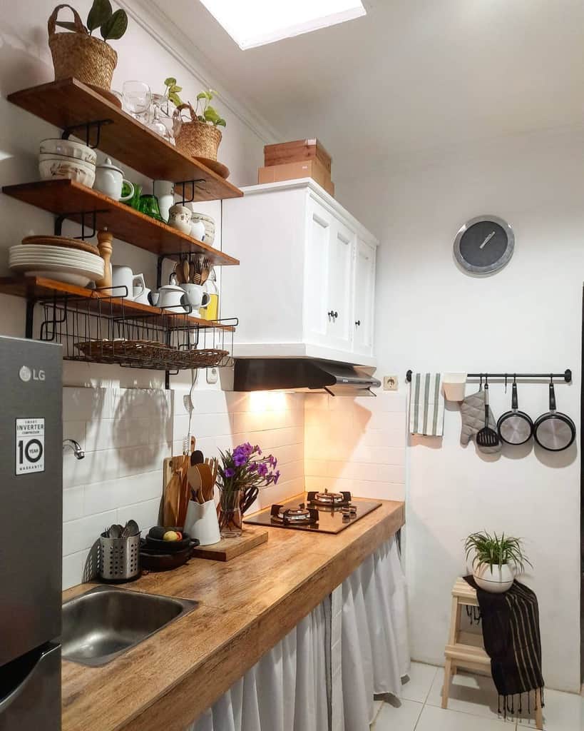 small cottage galley kitchen wood shelves white cabinets