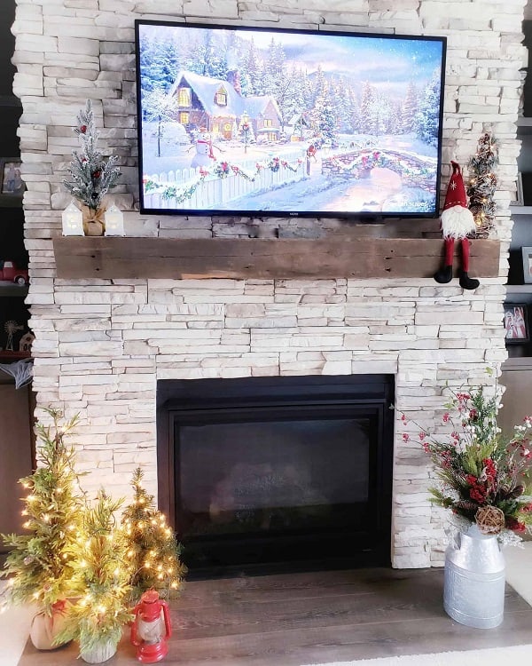 country living stone fireplace surround wall mounted tv christmas decorations