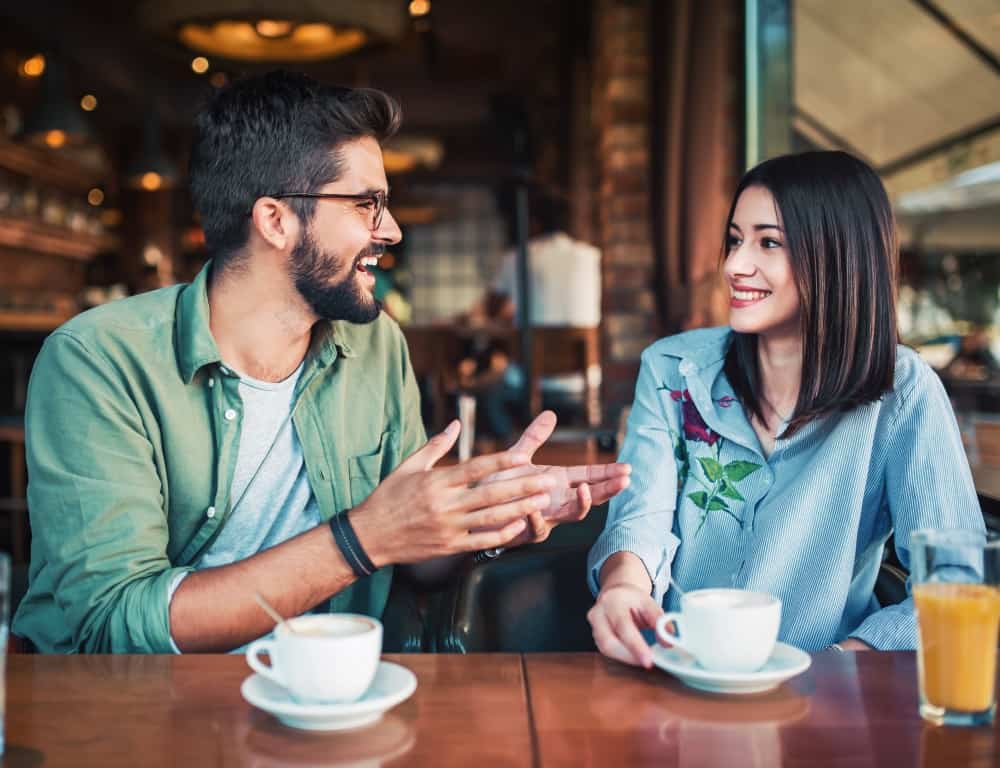 couple chatting each other in the coffee shop