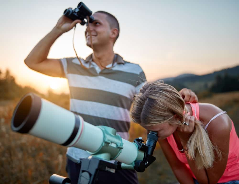 couple doing the stargazing outdoor