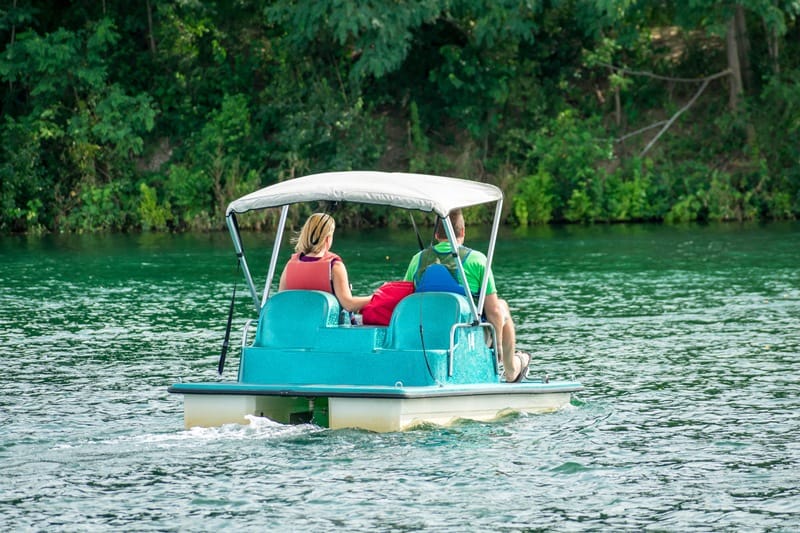 couple go paddle boating
