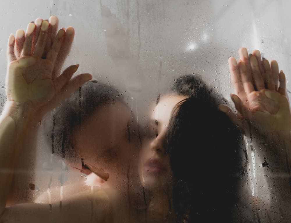 couple having sex while taking a shower
