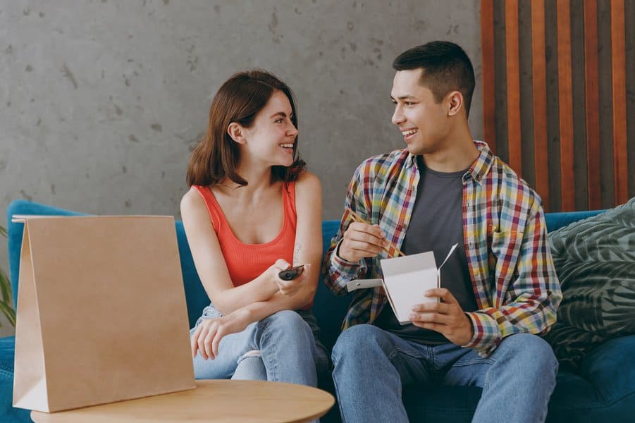 couple sit a sofa together