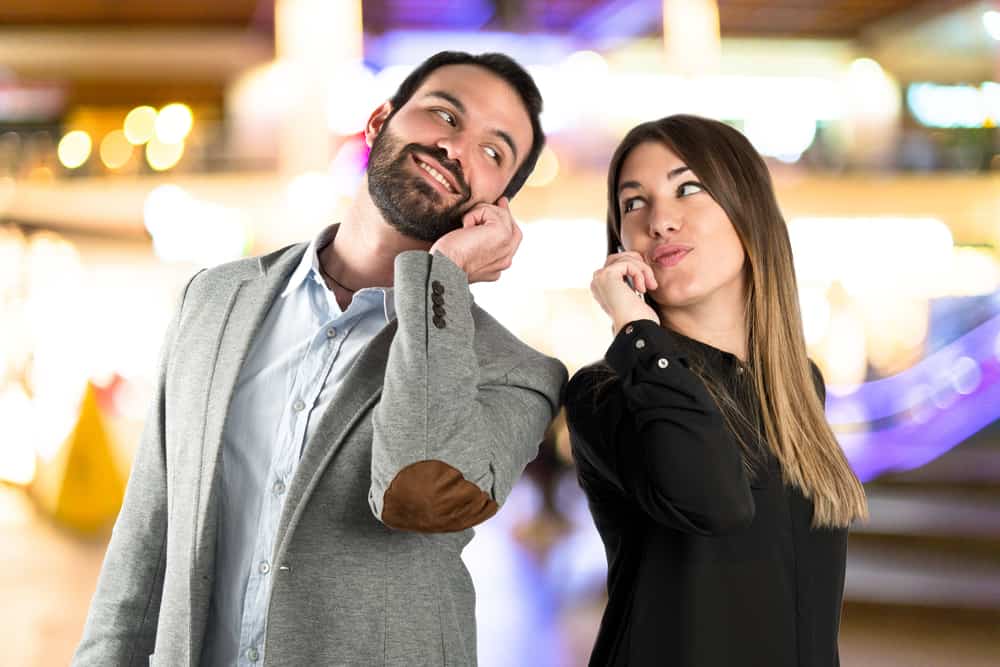 couple talking on mobile phone