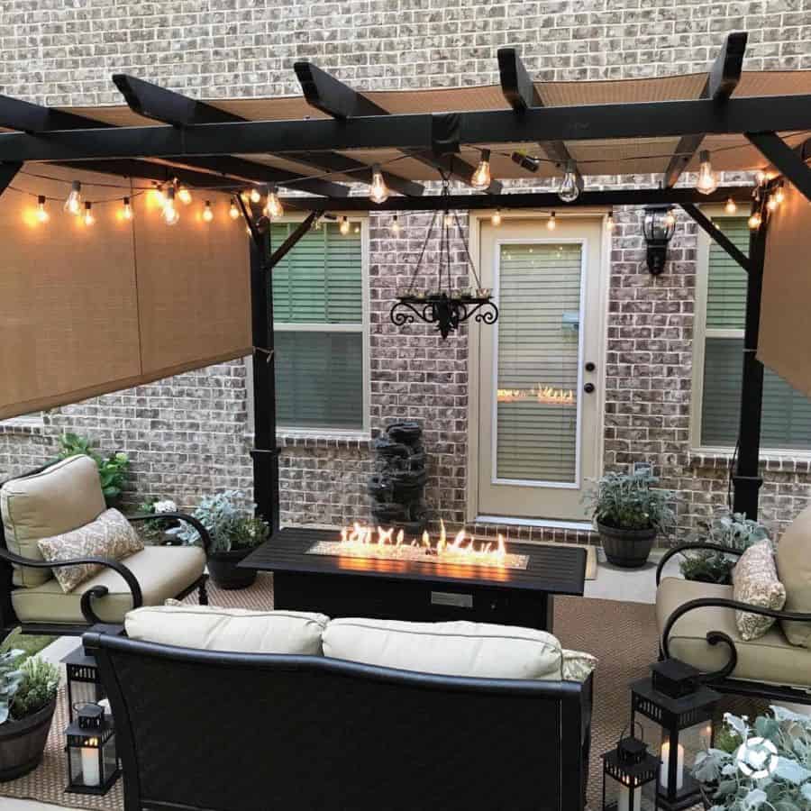 stylish backyard patio with shade pergola string lights and fire pit
