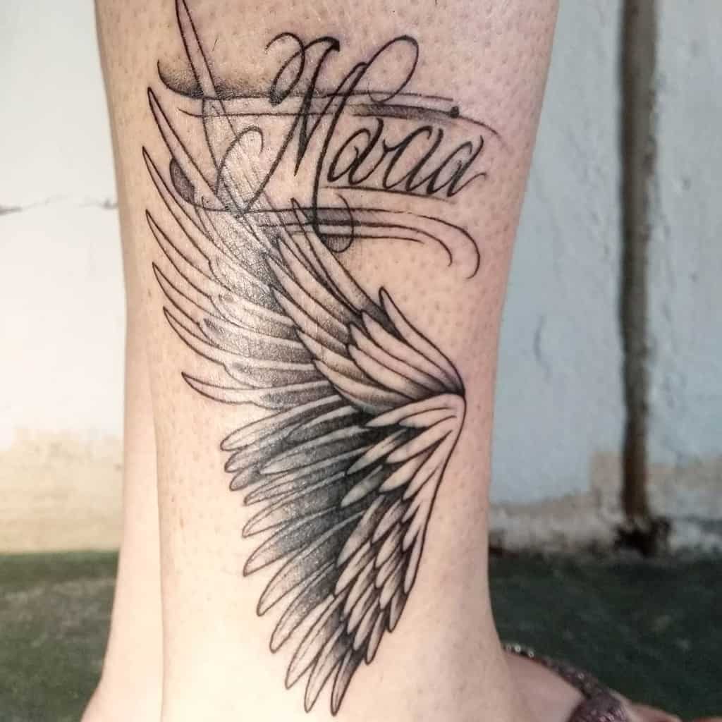 Elegant angel wing tattoo with the name "Maria" in flowing script