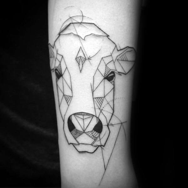 Abstract geometric cow tattoo with fine lines and dotted details, featuring symmetrical triangular patterns on the forearm.
