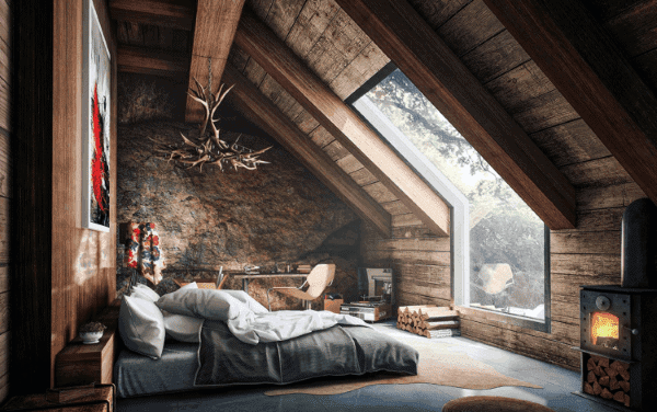 Cozy attic bedroom with slanted wooden ceiling, skylight, antler chandelier, and wood-burning stove
