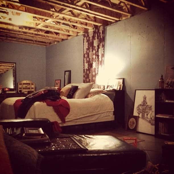 unfinished basement bedroom exposed wood ceiling 