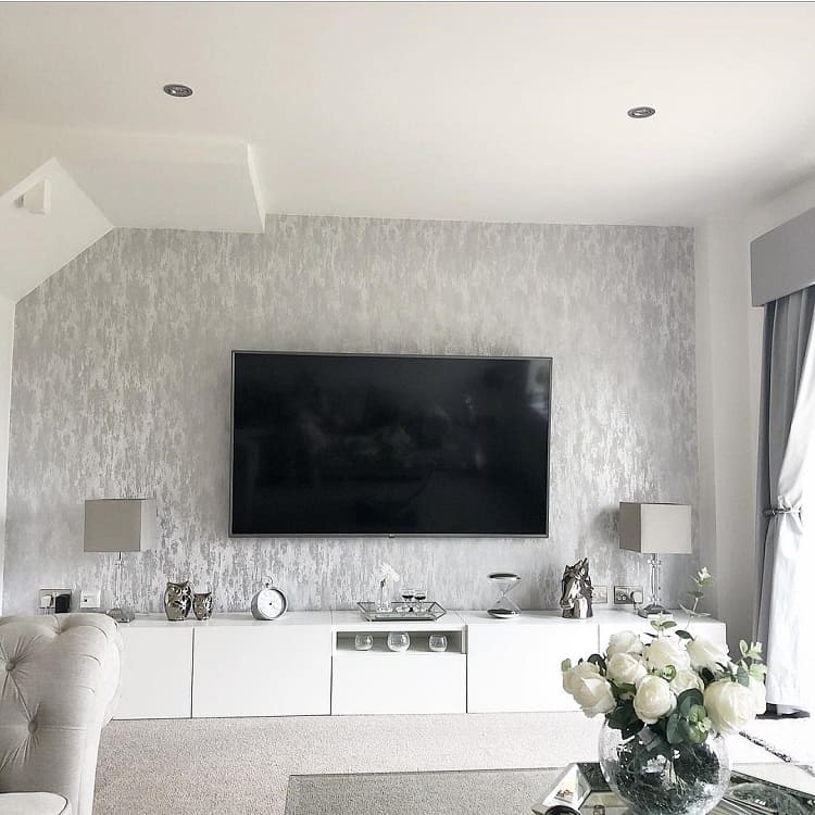 gray feature wall mounted tv white cabinet gray couch