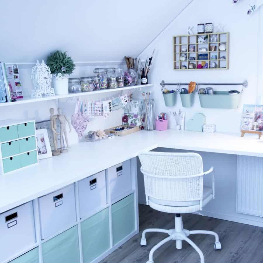 Chic and cozy crafting space with white furniture, organized storage, pastel accents, and creative supplies on display
