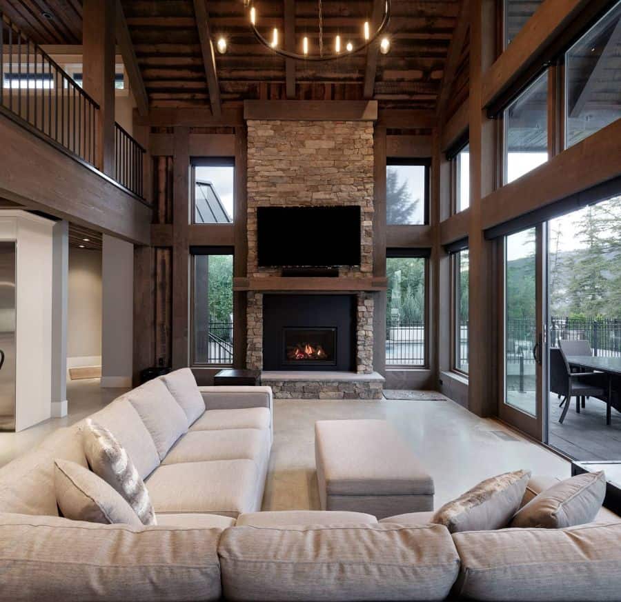 simple craftsman living room stone fireplace gray sofa