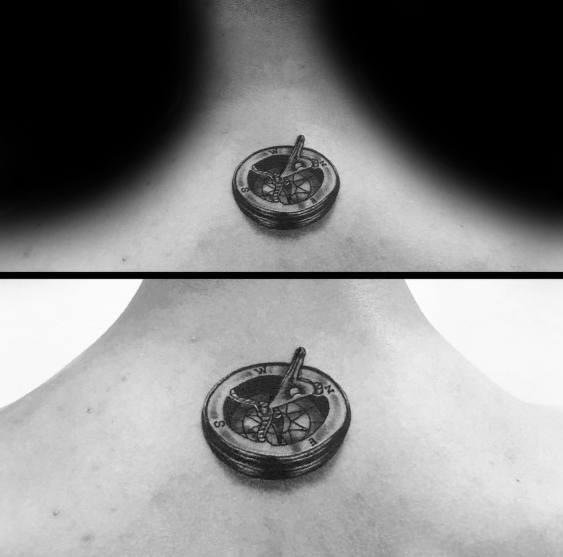 Realistic 3D sundial compass tattoo on the upper back, featuring intricate shading and depth, symbolizing time, guidance, and exploration.