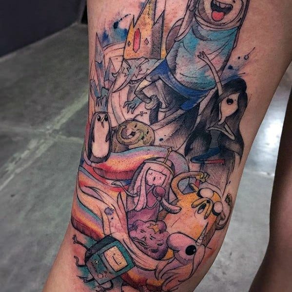 Watercolor-style Adventure Time tattoo featuring Finn, Jake, Princess Bubblegum, Marceline, BMO, Ice King, and other characters in a vibrant leg piece.