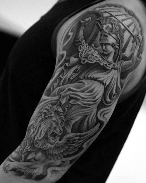 Full-sleeve Athena tattoo with raised sword, flowing robes, and a fierce winged lion in detailed black and grey realism