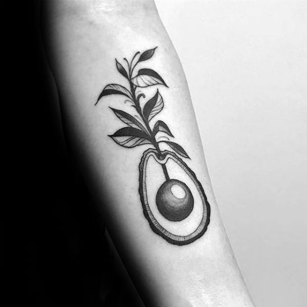 Elegant blackwork avocado tattoo with a plant growing from the pit, blending nature and minimalism in a forearm design.