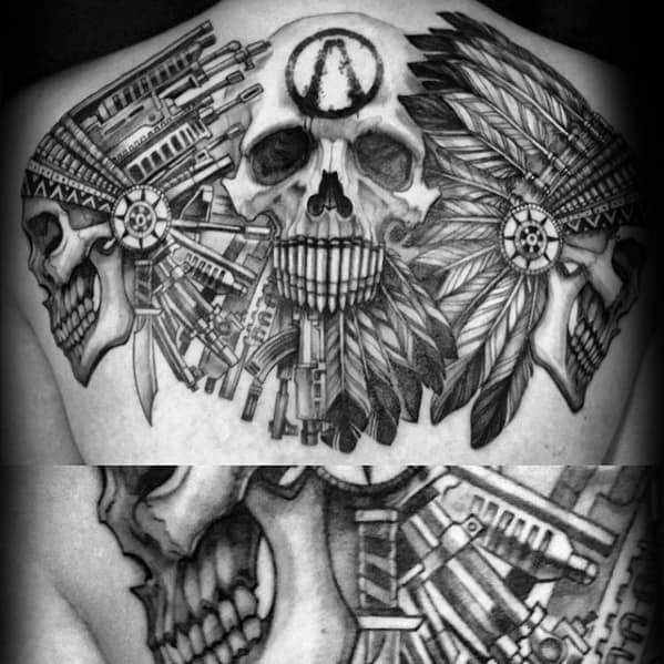 Black and grey back tattoo featuring three skulls, tribal-mechanical headdresses, and the Borderlands Vault symbol etched on the central skull’s forehead.
