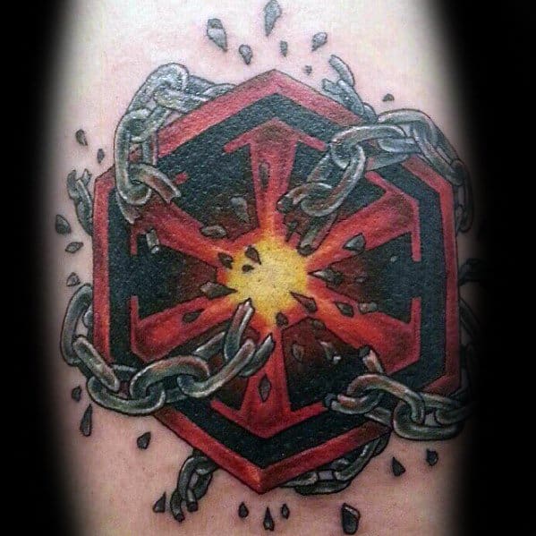 Red and black Sith Empire symbol tattoo bursting with glowing light at the center, surrounded by breaking metallic chains and debris.