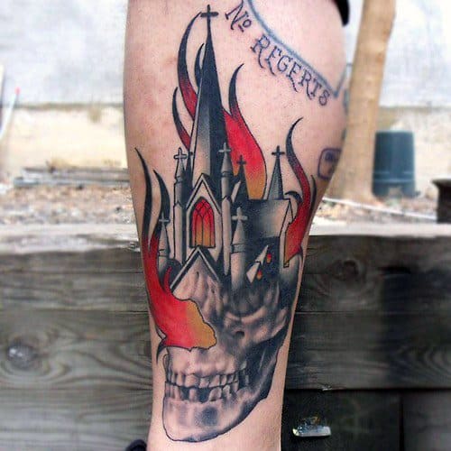 Burning gothic church tattoo with red flames and glowing windows. The base transforms into a detailed skull with the phrase “No Regerts” above.
