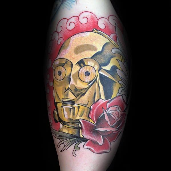 Neo-traditional C-3PO tattoo with bold outlines, red roses, and swirling clouds, blending Star Wars with classic tattoo aesthetics.