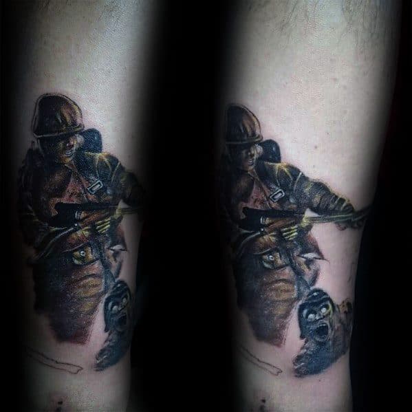 Realistic Call of Duty soldier tattoo with a war scene, featuring a detailed soldier aiming a rifle and a skull in a dramatic black and color design.