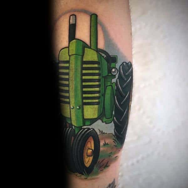 Bold and colorful tattoo of a classic green tractor facing forward, with large tires and simple grassy ground detail.