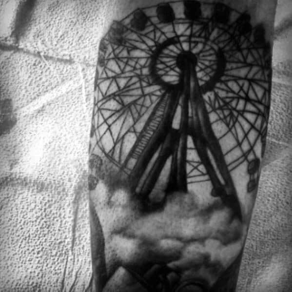 Realistic black and grey Ferris wheel tattoo with intricate shading, clouds at the base, and a dramatic perspective for a bold, immersive look.