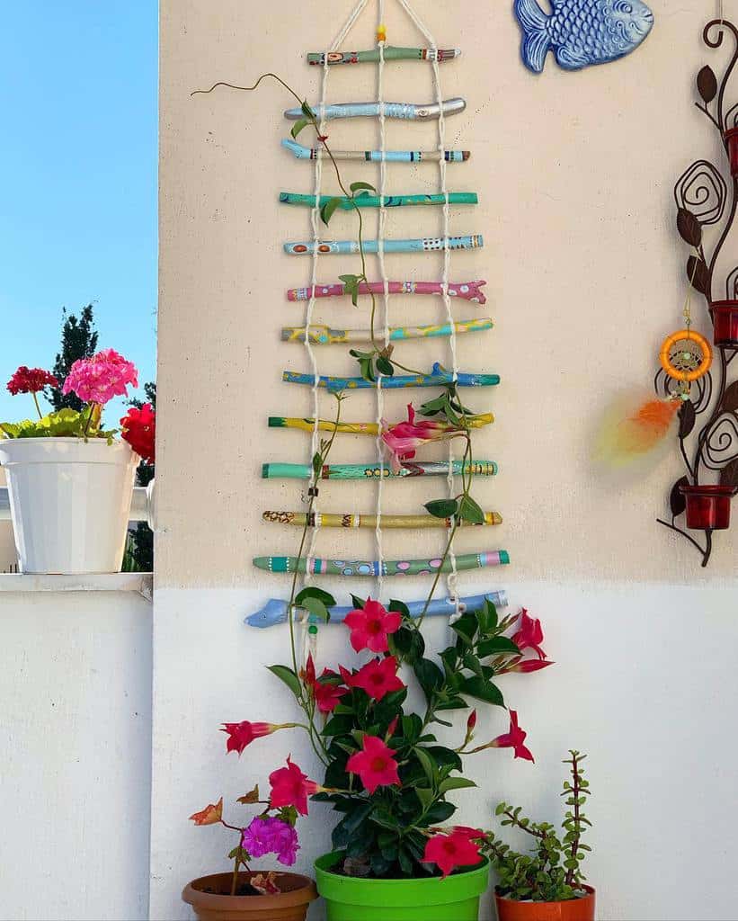 creative colored sticks garden trellis red flowers