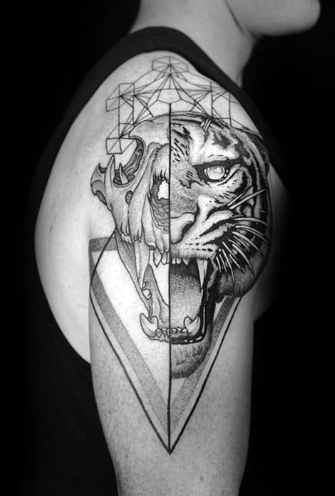 Upper arm tattoo of a roaring tiger with half realistic shading and half geometric lines, creating a bold contrast of styles.