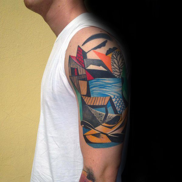 Colorful Cubist tattoo on upper arm depicting an abstract landscape with geometric waves, trees, and mountains in bold shapes.