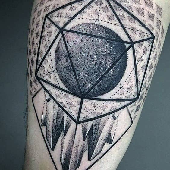 Geometric icosahedron tattoo featuring a realistic moon at its center with bold abstract shading and sharp crystal-like elements.