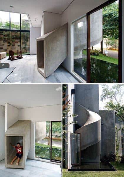 Modern house interior with a concrete slide leading outside; a child joyfully plays on the stylish slide