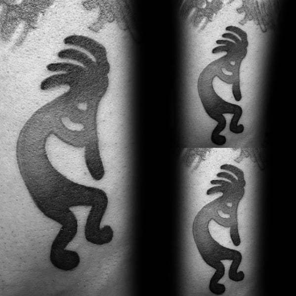 Bold black Kokopelli tattoo with smooth curves and solid shading, repeated in a mirrored trio layout for a modern tribal look.