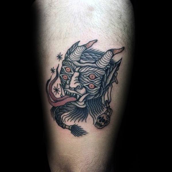 Traditional Krampus tattoo with six red eyes, curled horns, a long tongue, and snowflake details for a dark holiday-themed design.