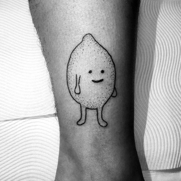 Simple black ink tattoo of a cute, smiling lemon character with tiny arms and legs in a minimalist cartoon style.