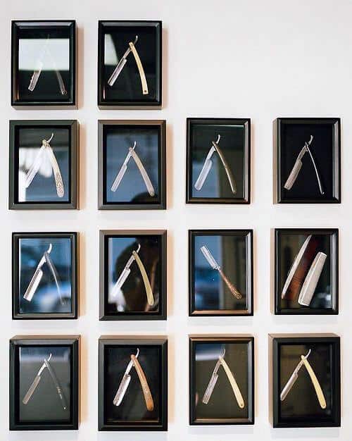 framed switchblades hanging on wall