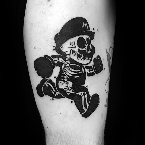 Black and white skeletal Mario tattoo with bold ink, featuring a spooky yet playful design that blends classic gaming with a dark aesthetic.
