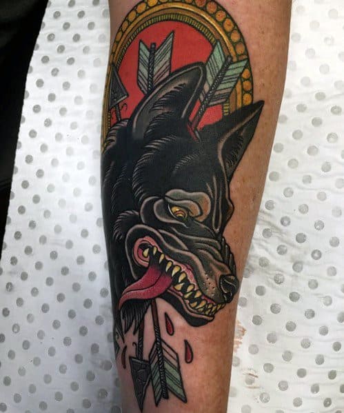 Neo-traditional tattoo of a black wolf with arrows piercing through, a red and gold background, bold shading, and intricate detailing.