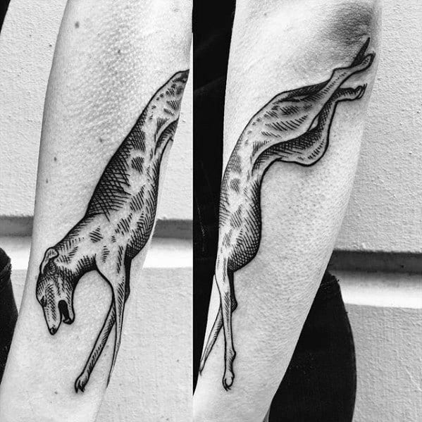 A dynamic black and white tattoo of a greyhound in mid-leap, captured with detailed shading to emphasize its movement and sleek form.