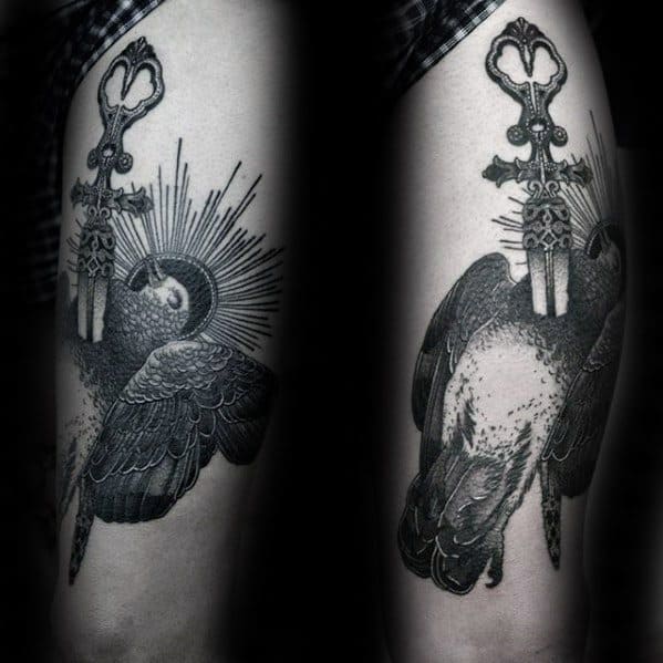 Detailed black and grey pigeon tattoo with radiant halo, clutching ornate keys in its beak, symbolizing guidance and spiritual power.